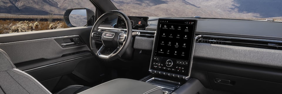 The 2026 GMC Sierra EV Pickup Truck Interior Dashboard and Steering Wheel