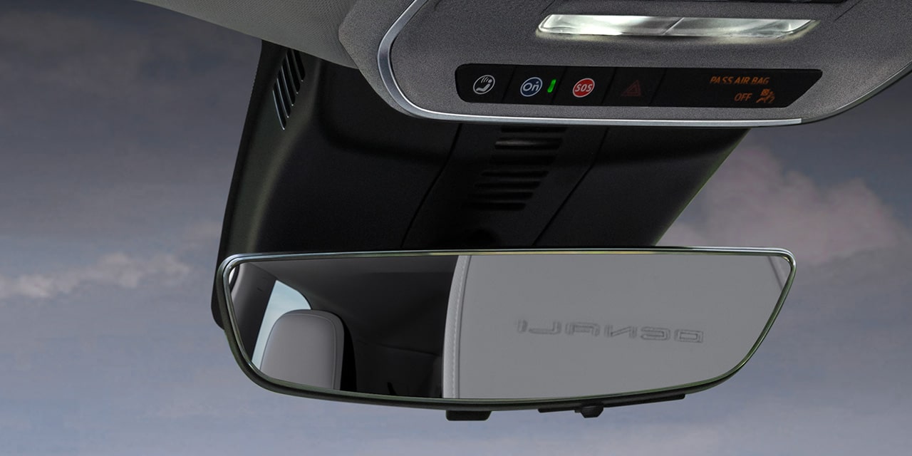 Close-up of the Driver Pressing the OnStar Button in Their GMC