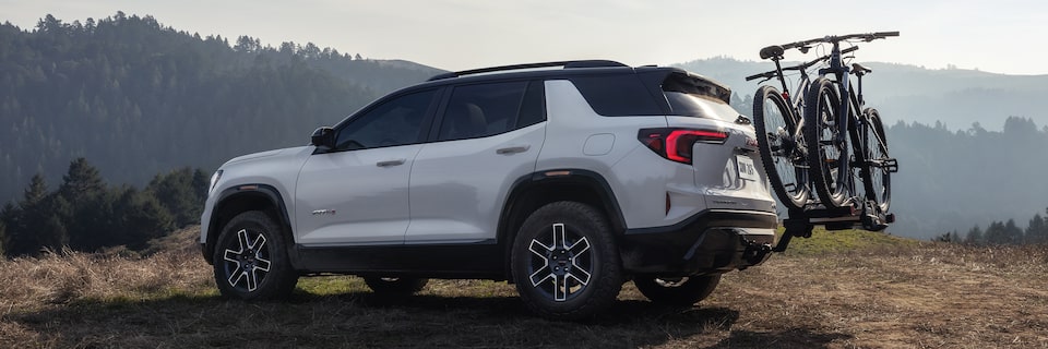 Profile View of the 2026 GMC Terrain AT4 Small Off-Road SUV with a Bike Rack Attached