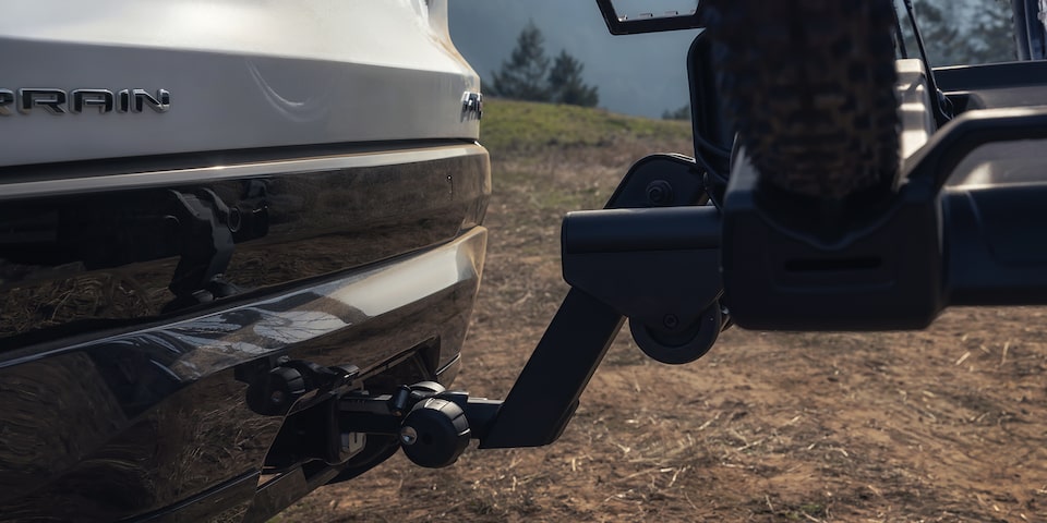 Close-up View of the Hitch on the 2026 GMC Terrain AT4 Small Off-Road SUV Driving Through the Forest