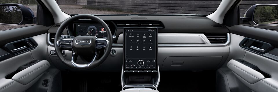 Interior View of the Dashboard, Steering Wheel and Infotainment System in the 2026 GMC Terrain Denali Luxury SUV