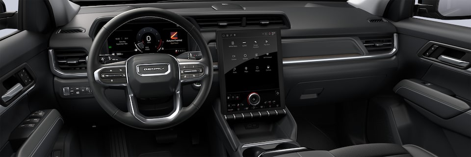 Close-up of the Diagonal Premium GMC Infotainment System, Steering Wheel, and Dashboard in the 2026 GMC Terrain
