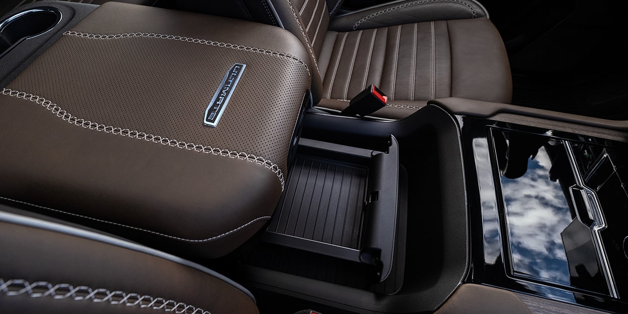 Close-up of the Power-Sliding Center Console in the 2026 GMC Yukon Denali Luxury 3 Row SUV