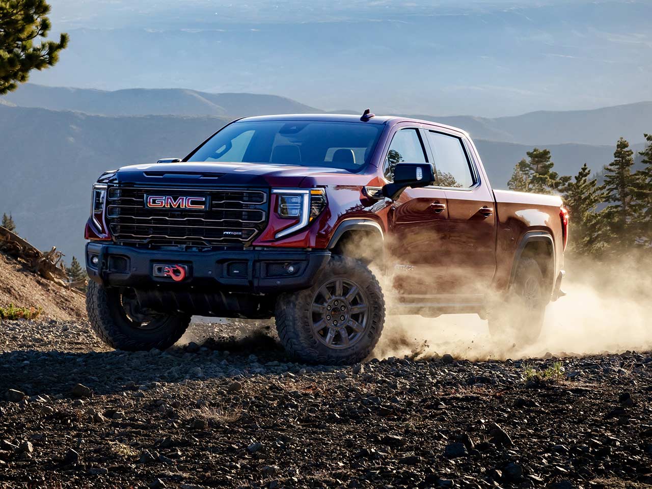 The 2026 GMC Sierra AT4 Off-Road Truck Speeding Down a Dirt Road with Ease