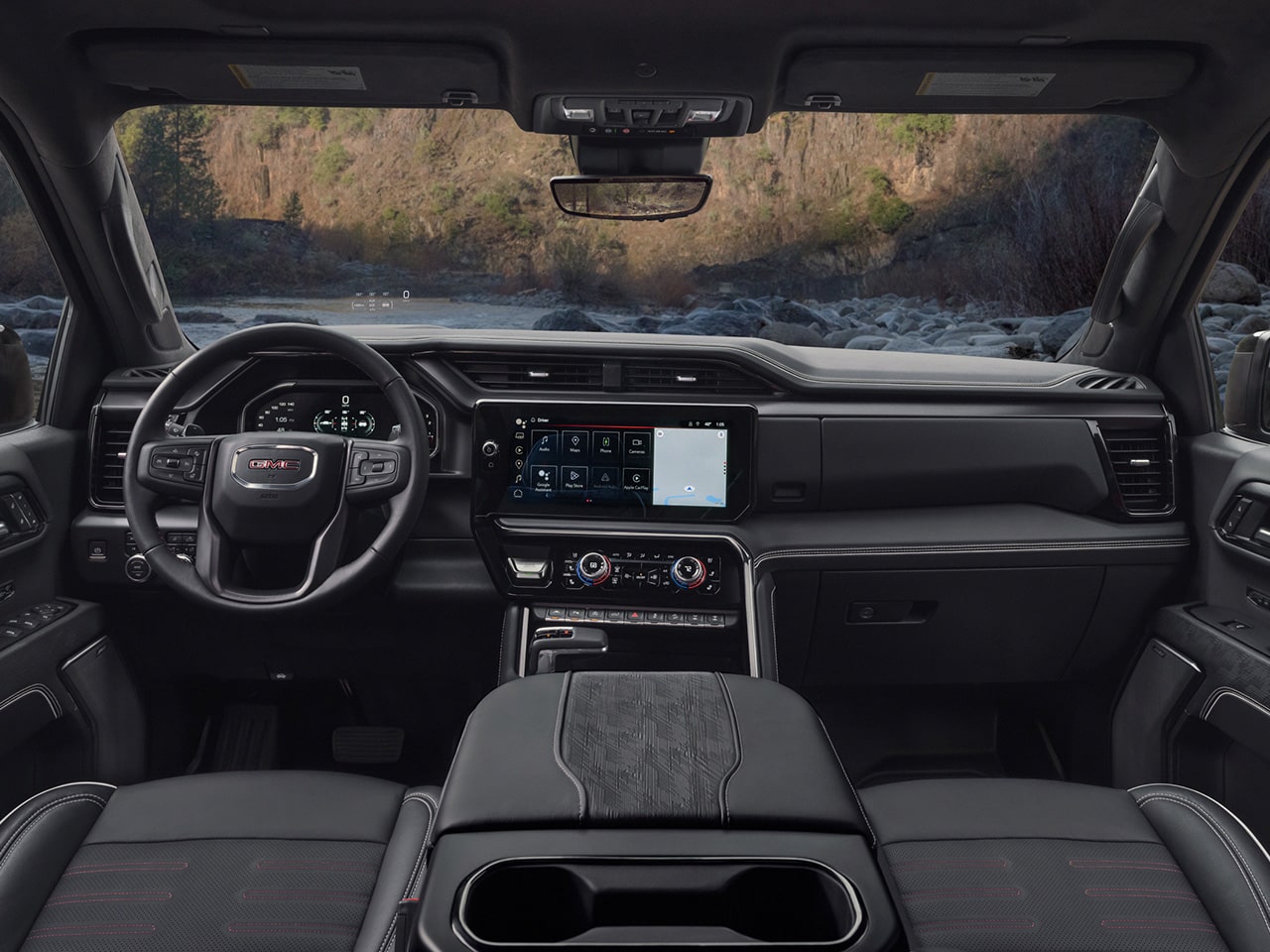 Interior View of the Dashboard and Infotainment System in the 2026 GMC Sierra AT4X Off-Road Truck, Obsidian Rush color