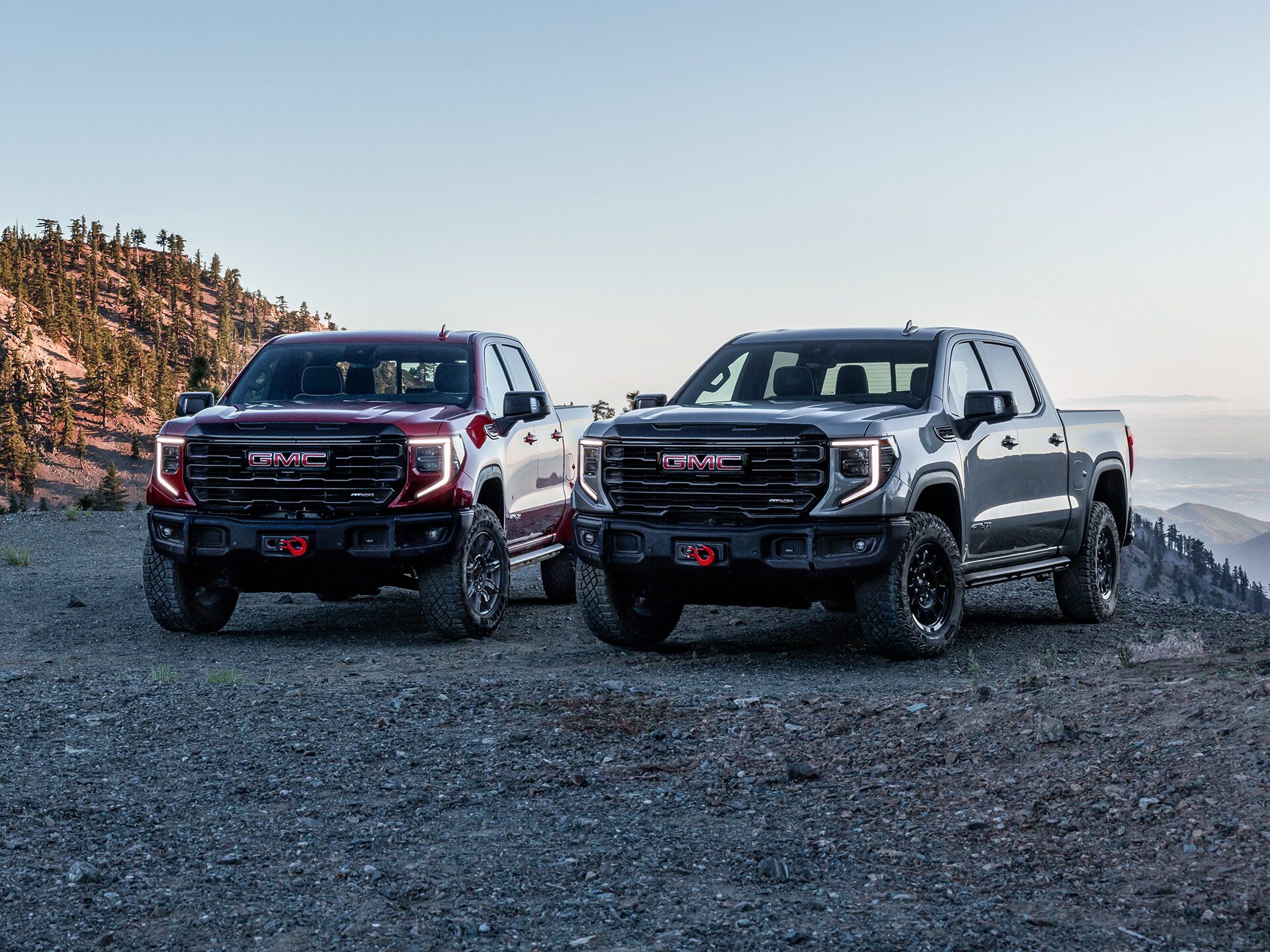 The GMC Sierra AT4 and At4X Off-Road Trucks Parked Side by Side