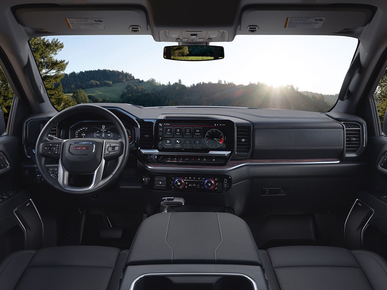 Interior View of the Front Outboard Seats with Perforated Leather Appointments in the GMC Sierra 1500 Pickup Truck