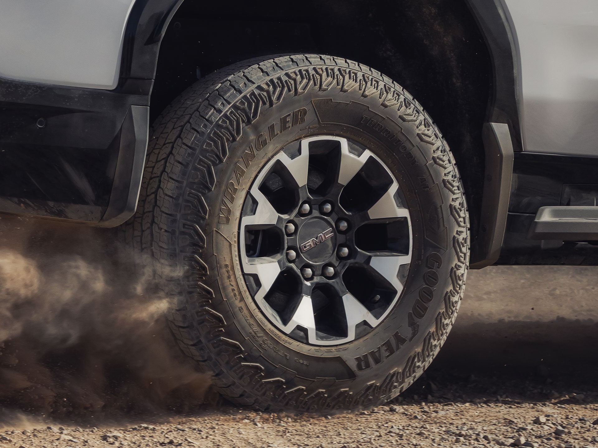A Close Up View of the Rugged Wheels on a GMC Sierra EV Truck