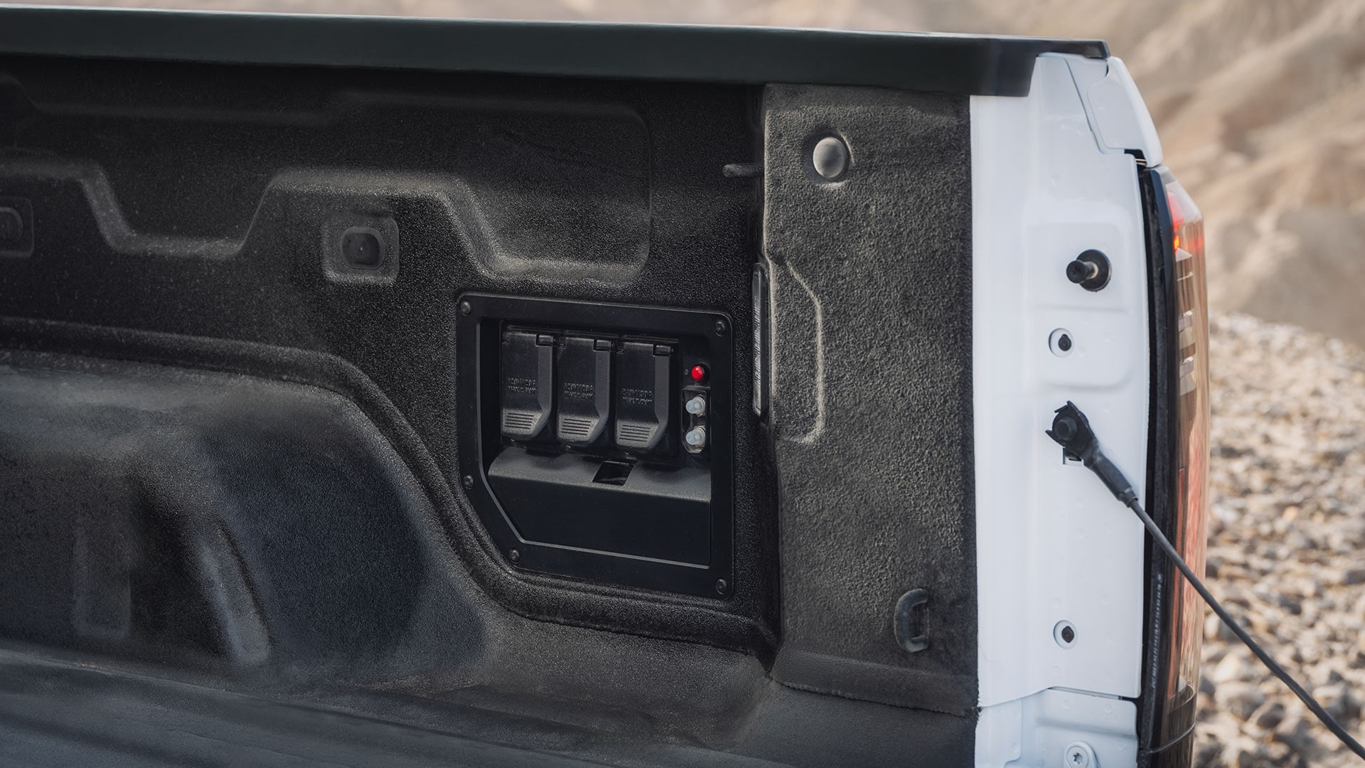 A Rugged GMC Sierra EV Truck Bed Featuring Durable Power Outlets for Enhanced Electrical Capability