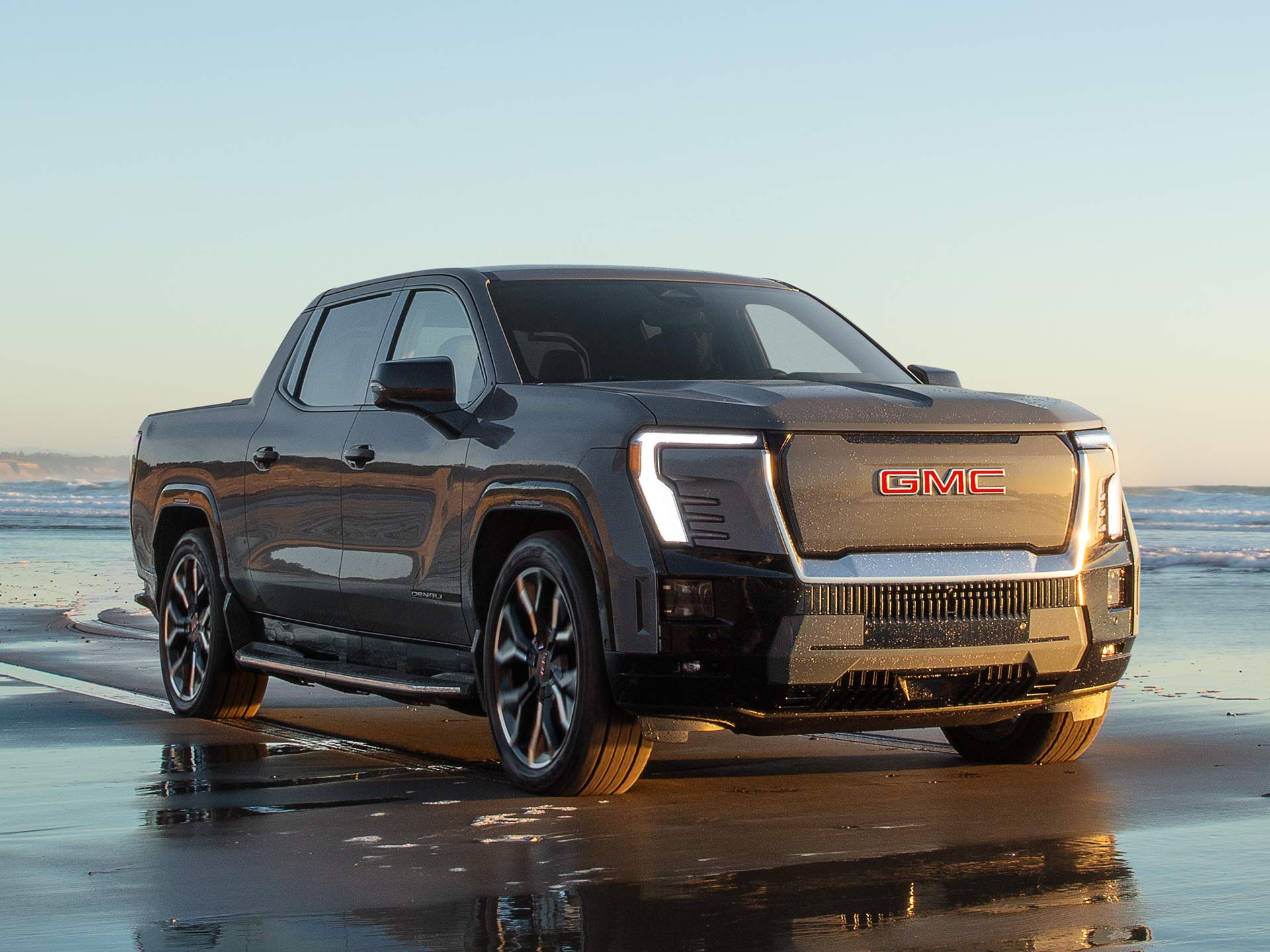 TESTA Powerful GMC Sierra EV Denali Parked on the Beach Showcasing its Air Ride Capability