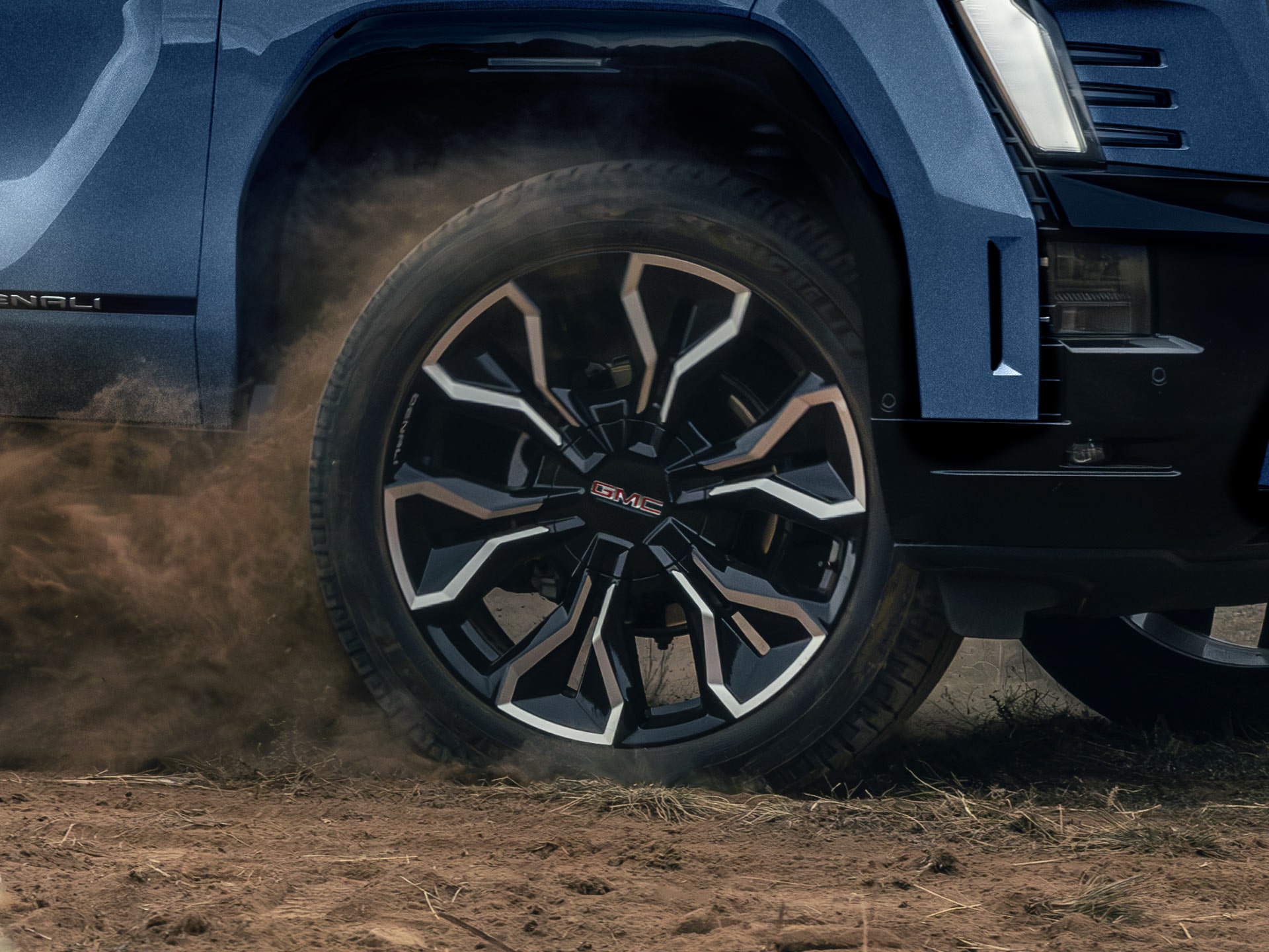 The Bold GMC Sierra EV Denali Wheel Design Kicking up Dust on the Trail