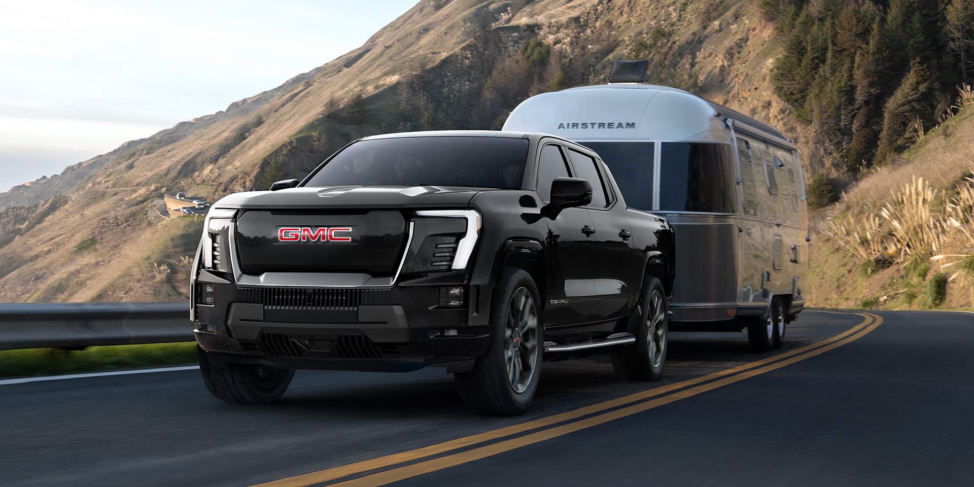 fpoA Black GMC Sierra EV Denali Demonstrating Exceptional Towing Capability with an Airstream Travel Trailer
