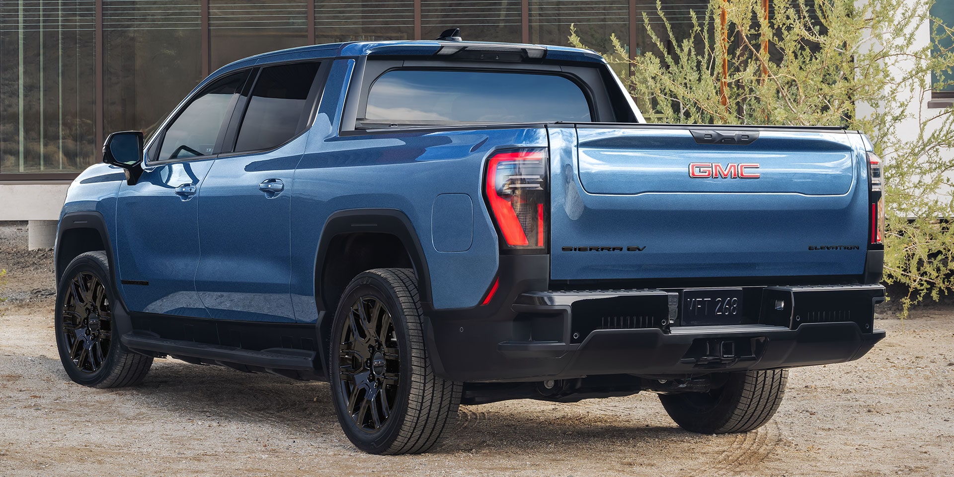 A Rear View of a Blue GMC Sierra EV Elevation Highlighting the Versatile and Capable Truck Bed
