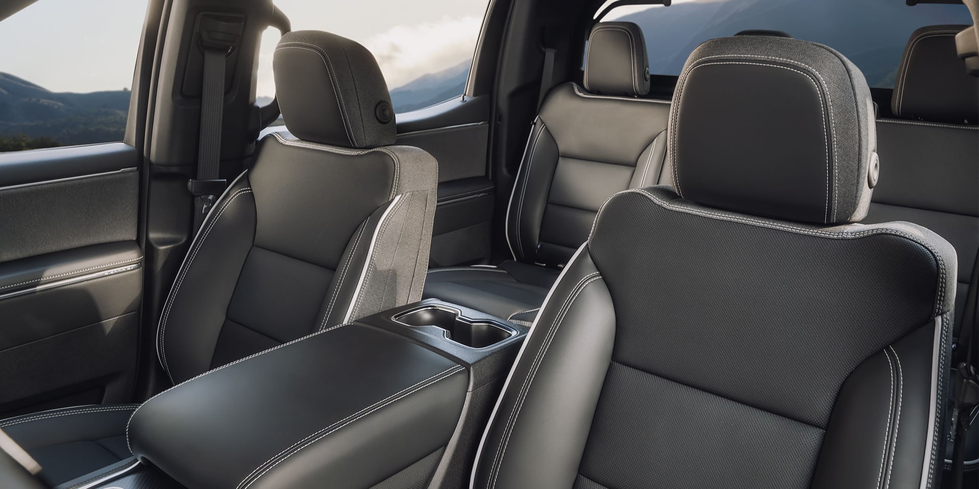 The Spacious premium Leather Interior of a GMC Sierra EV Featuring Bold Stitching and Seating