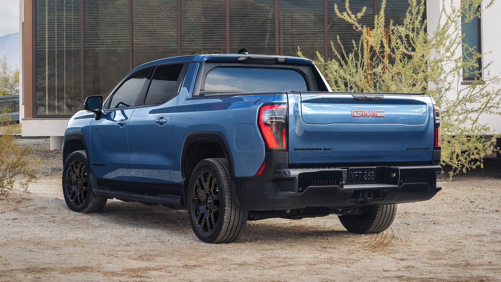 A Rear View of a Blue GMC Sierra EV Elevation Highlighting the Versatile and Capable Truck Bed