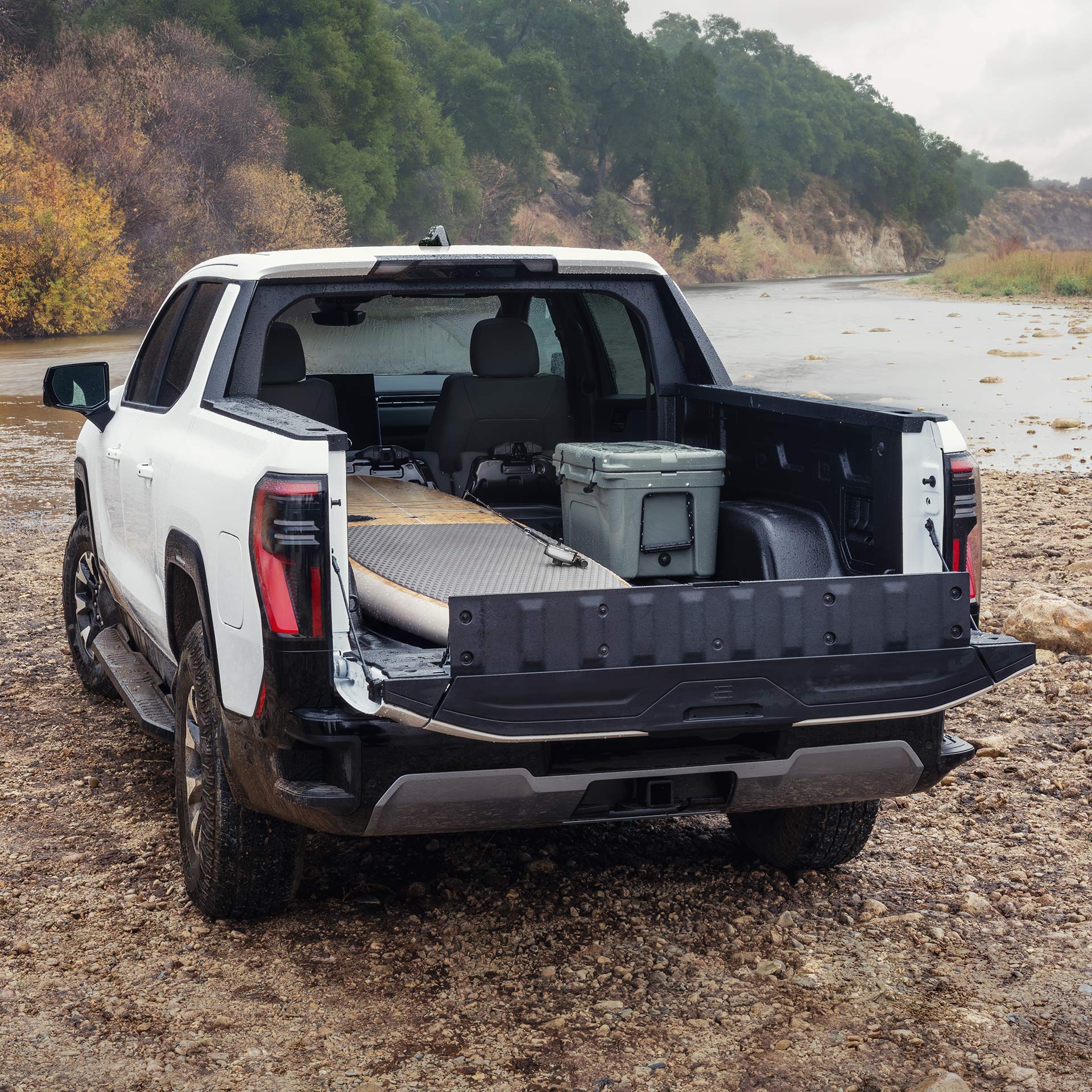 The Spacious Truck Bed of a GMC Sierra EV AT4 with a Versatile Midgate Feature