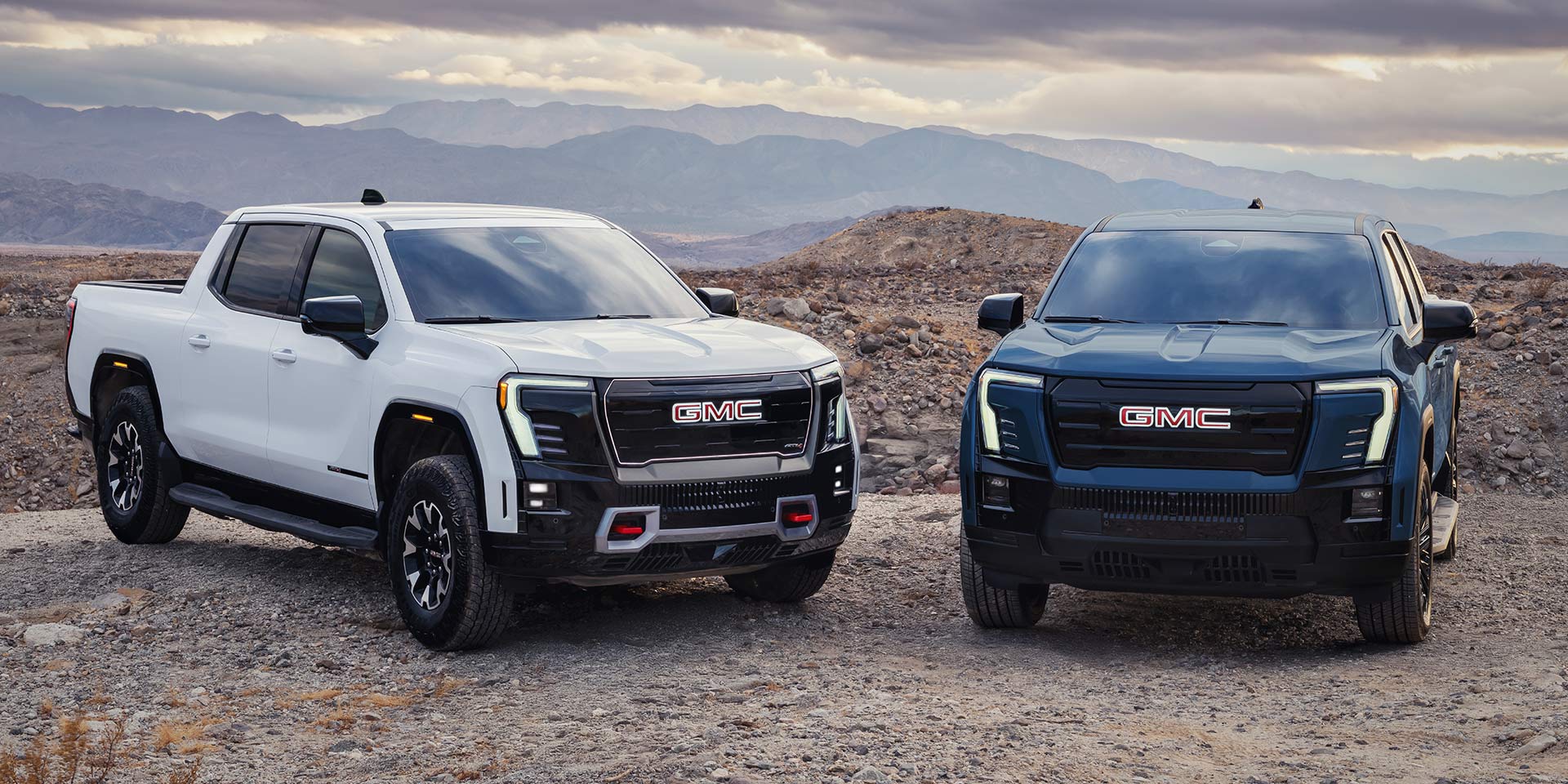A White and Blue GMC Sierra EV Trucks Showcase a Bold Exterior Design