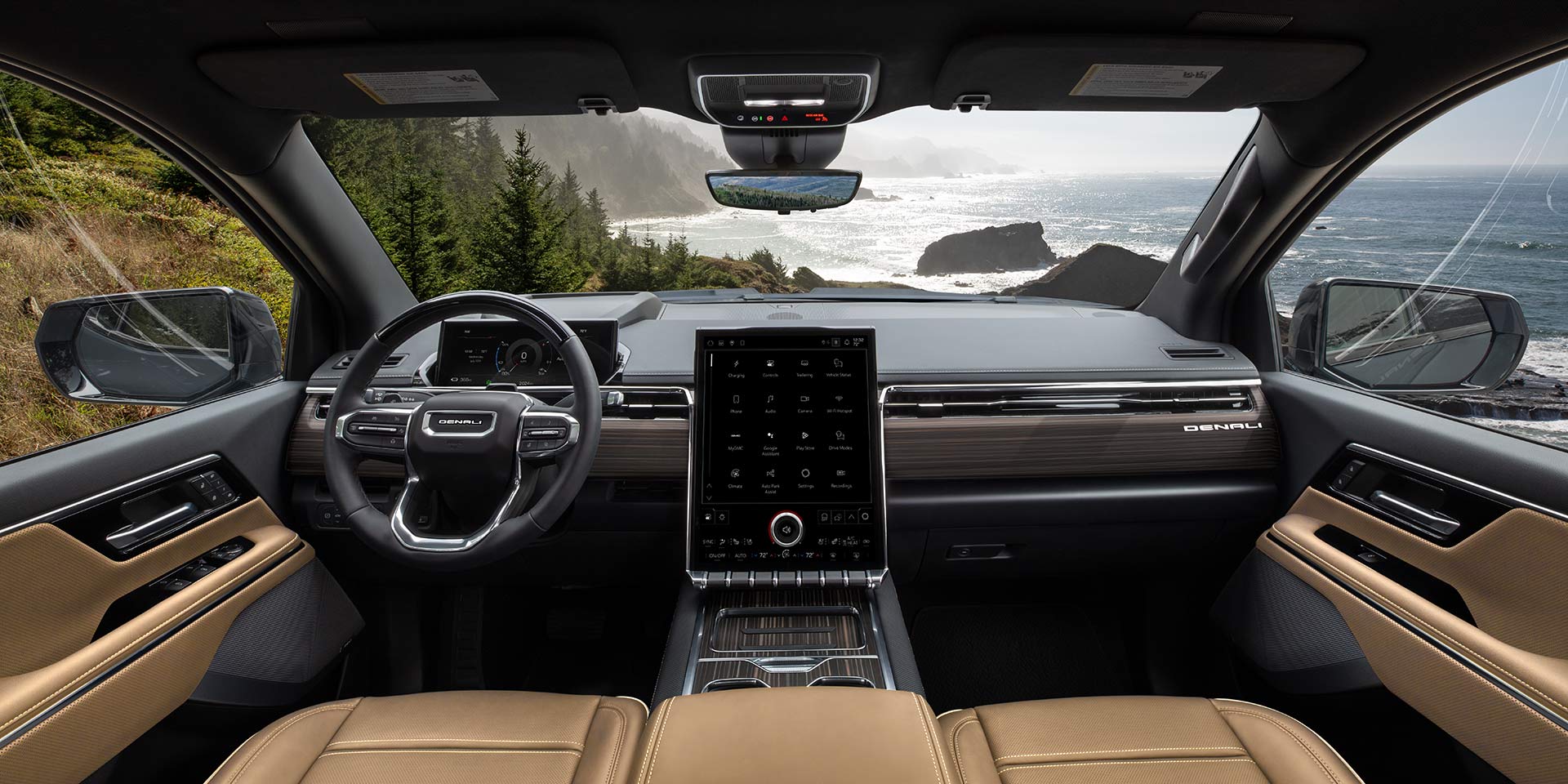 The Luxurious GMC Sierra EV Denali Interior Offers a View of a Coastal Highway