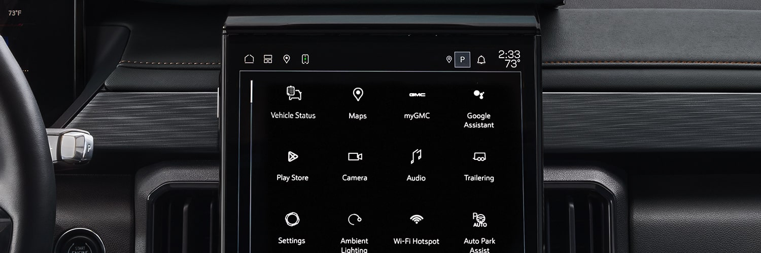 An Interior View of a GMC Vehicle's Infotainment System Displaying Various App Icons Like Maps, MyGMC, and Settings