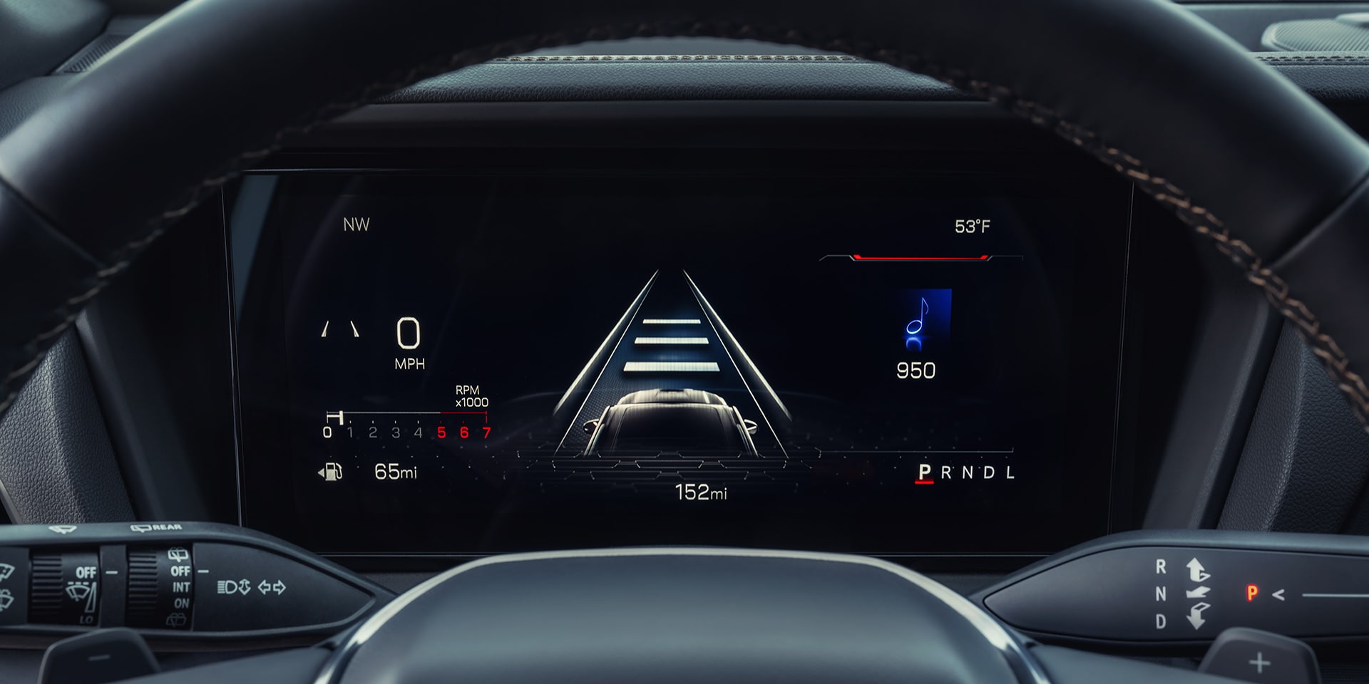 A Driver's Perspective of a GMC Digital Dashboard Displaying Navigation Speed and Vehicle Status with a GMC Logo on the Steering Wheel