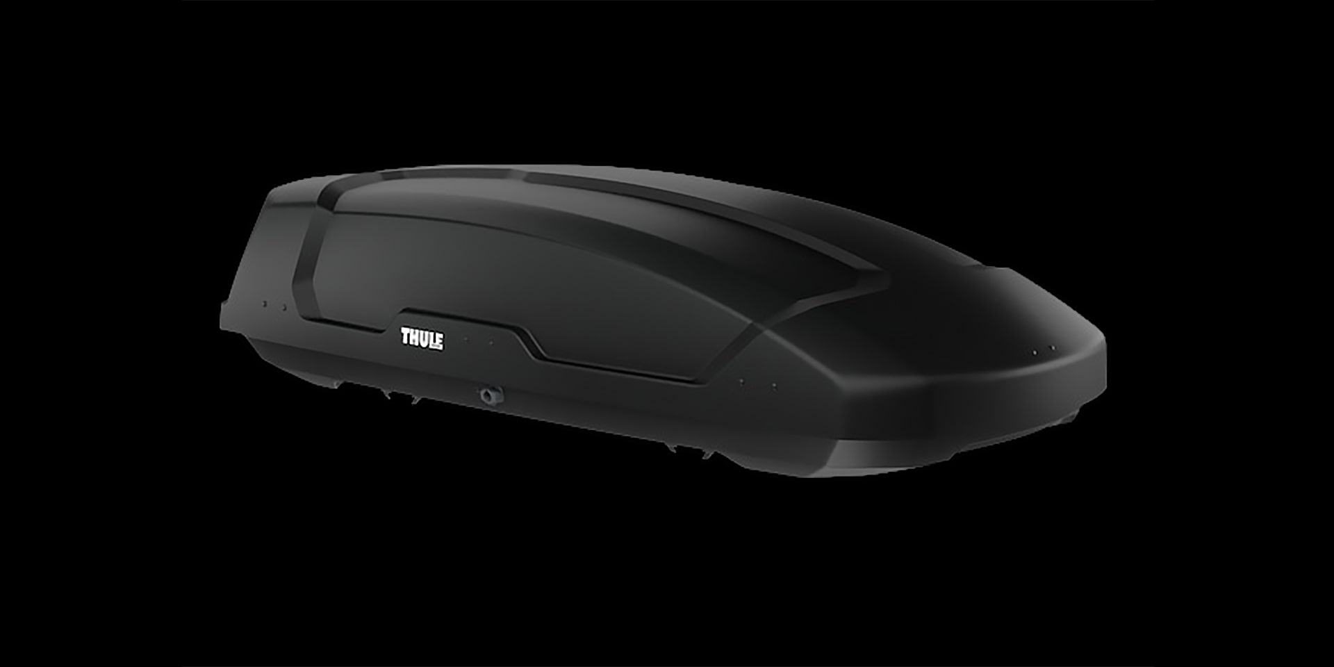 A Black Thule Roof Cargo Box with a Ribbed Design on Top Shown Against a Dark Background The Thule Logo is Visible on the Side