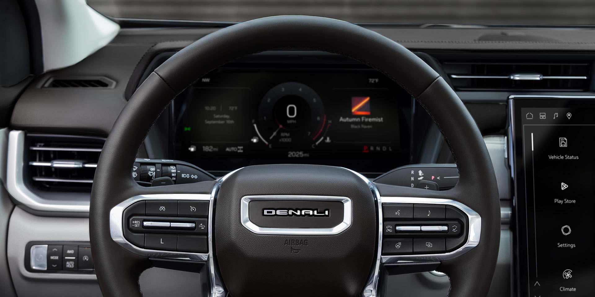 The Driver's View of the GMC Denali Steering Wheel and Digital Instrument Cluster Displaying Vehicle Information