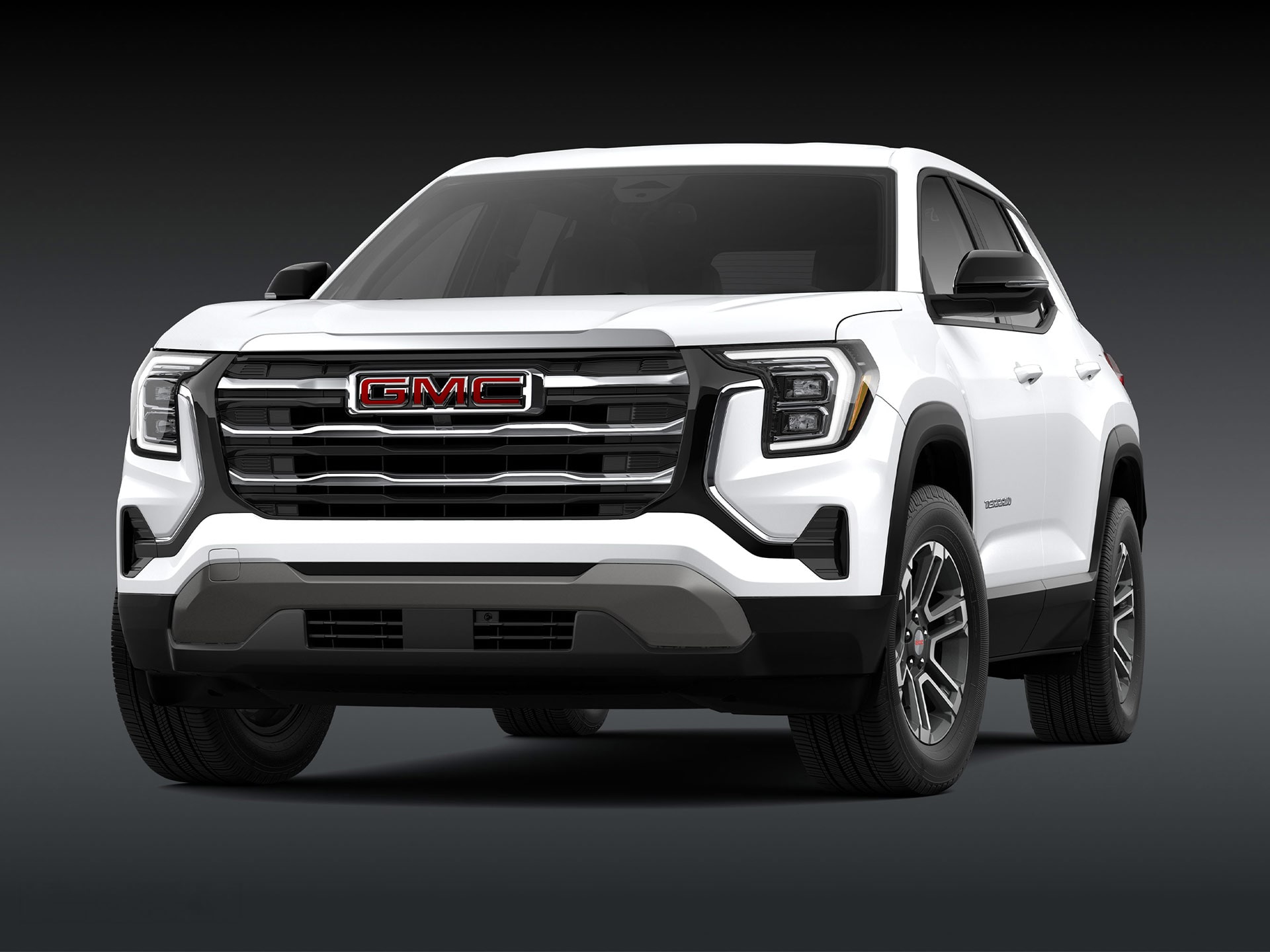 A Front View of a 2026 GMC Elevation SUV in White with a Chrome Grille