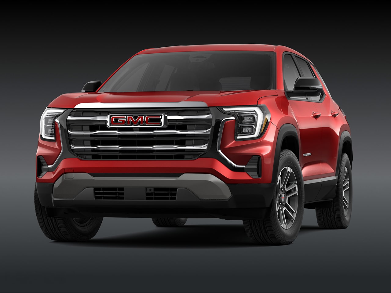 A Front View of a 2026 GMC Elevation SUV in Red with a Chrome Grille