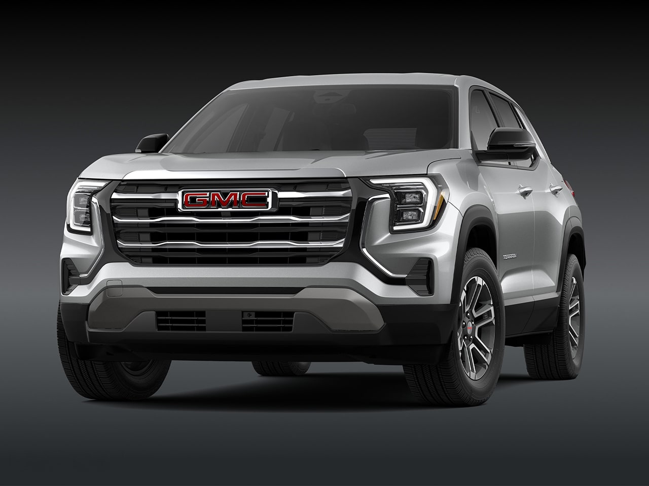 A Front View of a 2026 GMC Elevation SUV in Silver with a Chrome Grille