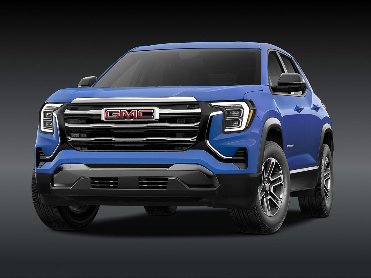 A Front View of a 2026 GMC Elevation SUV in Blue with a Chrome Grille