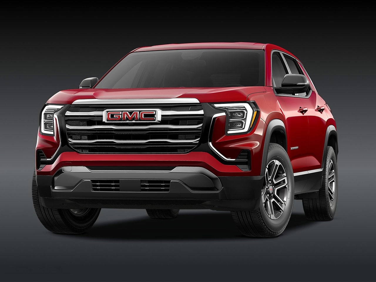 A Front View of a 2026 GMC Elevation SUV in Red with a Chrome Grille