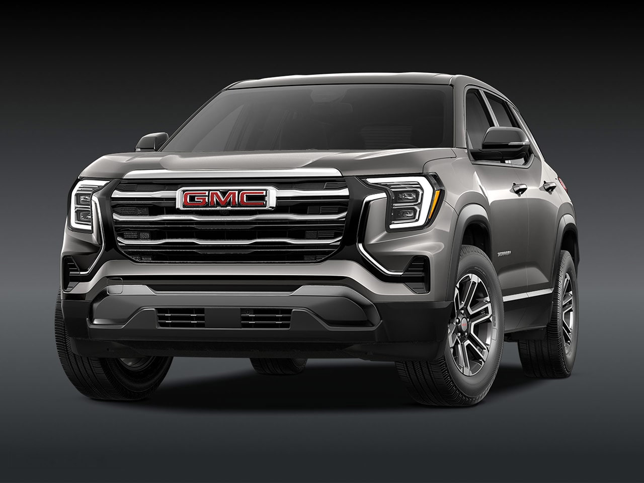 A Front View of a 2026 GMC Elevation SUV in Silver with a Chrome Grille