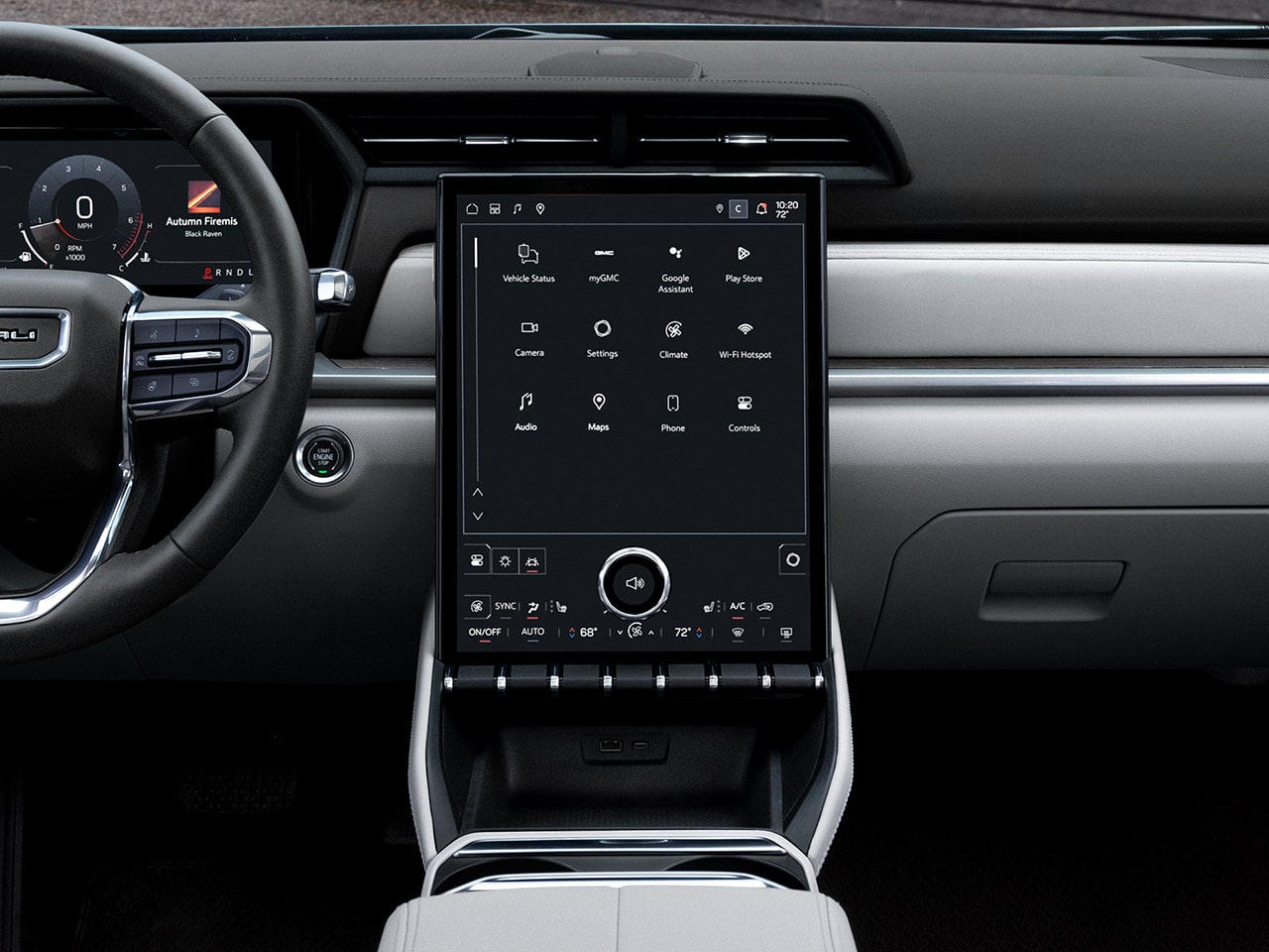 The Interior Dashboard of a GMC Vehicle Showing a Large Touchscreen Infotainment System With Various App Icons