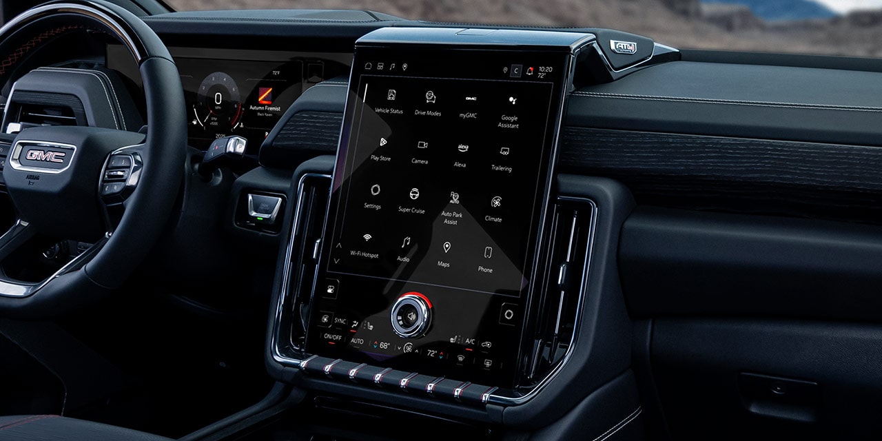 Interior Dashboard of the 2027 GMC Yukon Featuring a Large Vertical Infotainment Touchscreen and Climate Controls