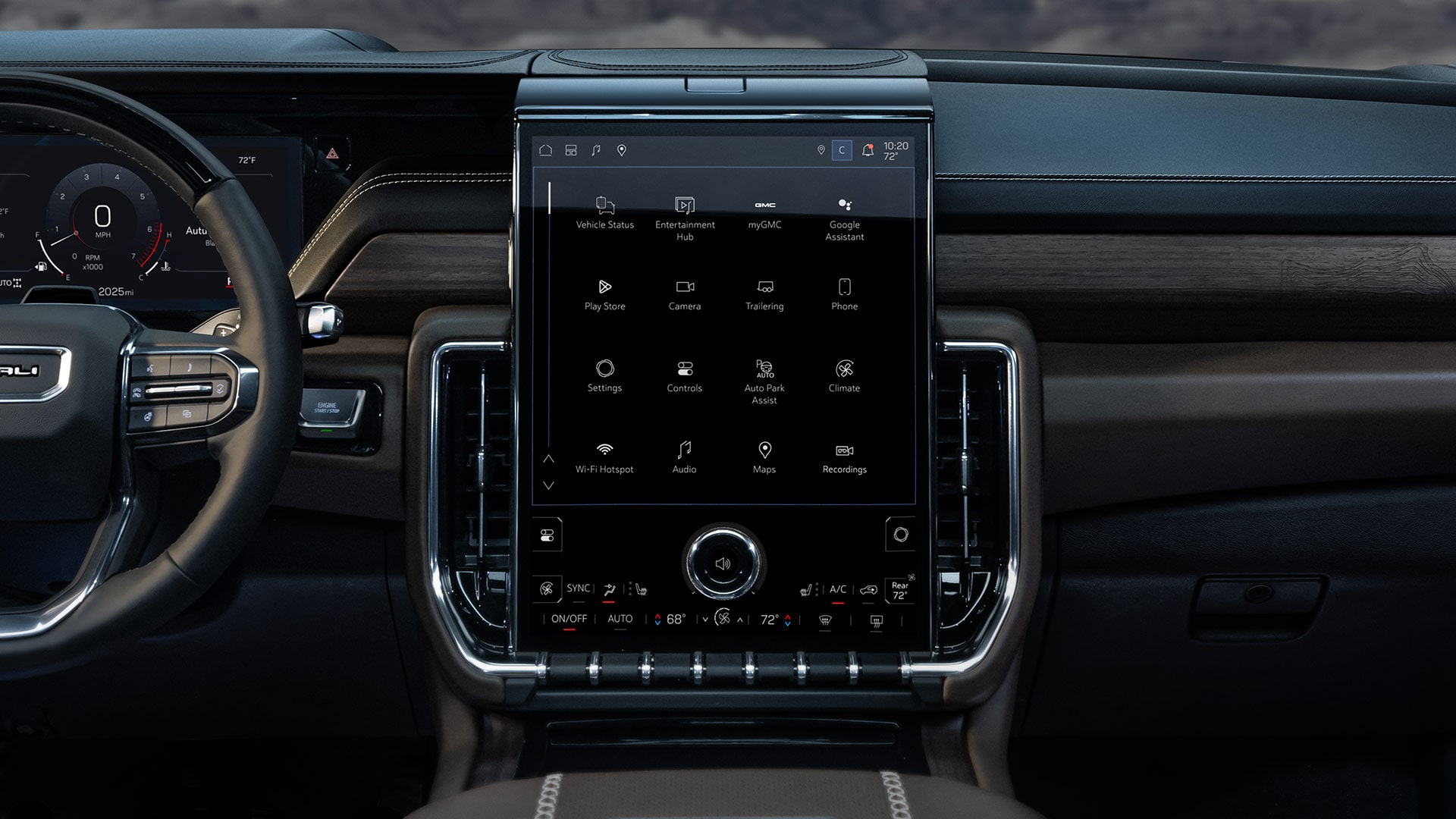 Wide Interior View of the 2027 GMC Yukon Denali Dashboard with a Steering Wheel and Large Infotainment Screen Against a Mountain Backdrop
