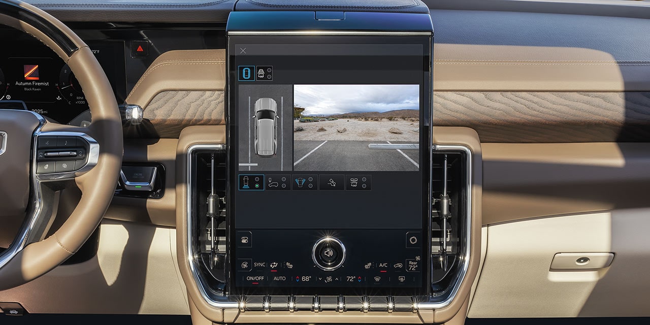 A Vertical Infotainment Screen in a GMC Yukon Displaying a Surround View Camera of the Vehicle