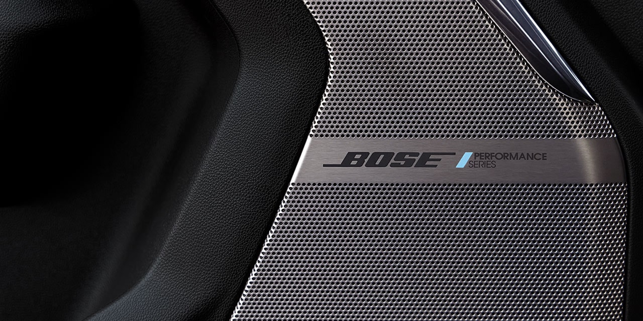 A Close-up of a Bose Performance Series Speaker Grille in a GMC Yukon Interior