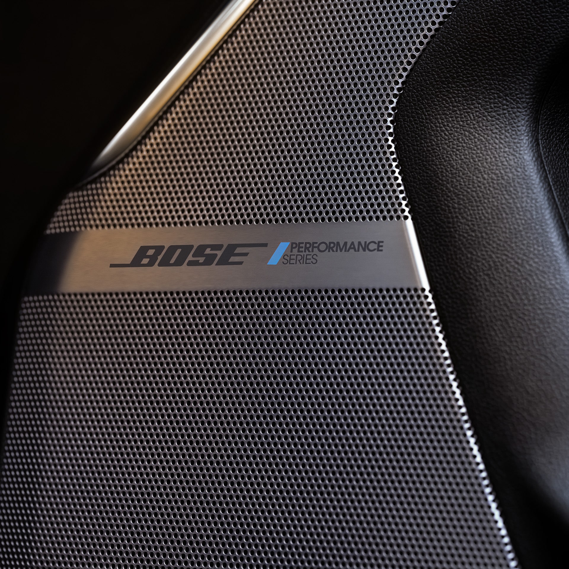 A Close-up of a Bose Performance Series Speaker Grille in a GMC Yukon Interior