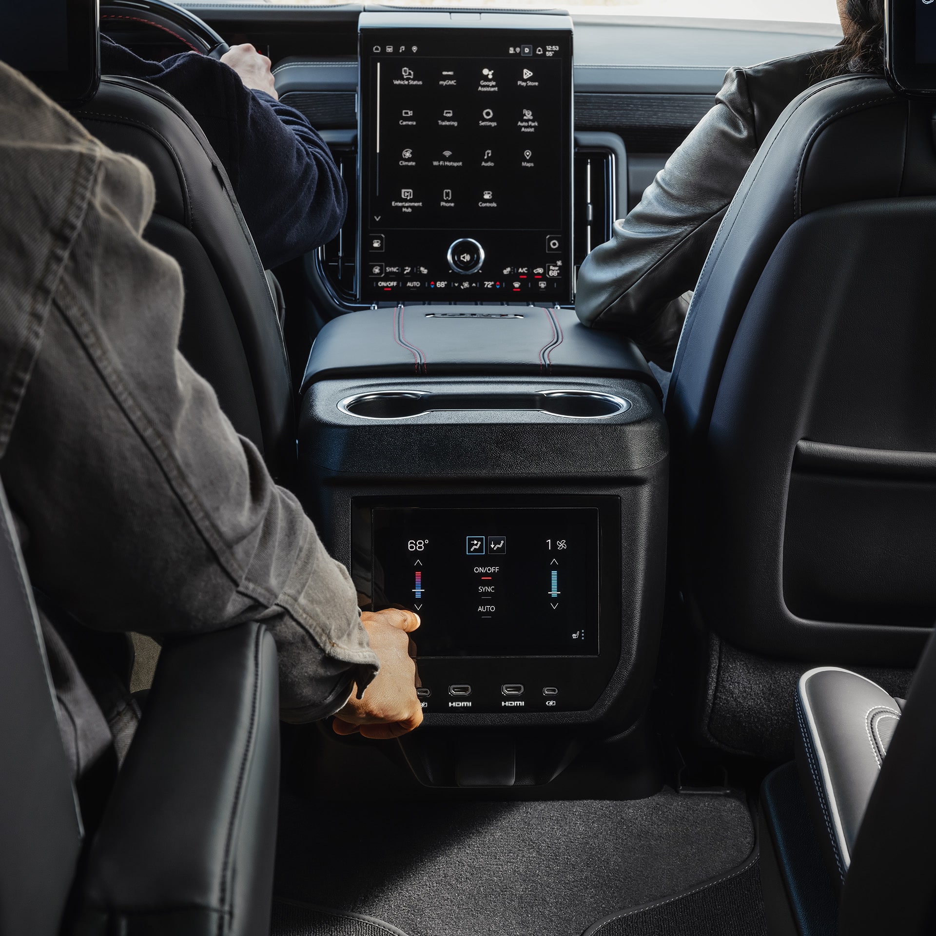 Rear-Seat Passengers Adjusting Climate Controls on the Center Console of a 2027 GMC Yukon
