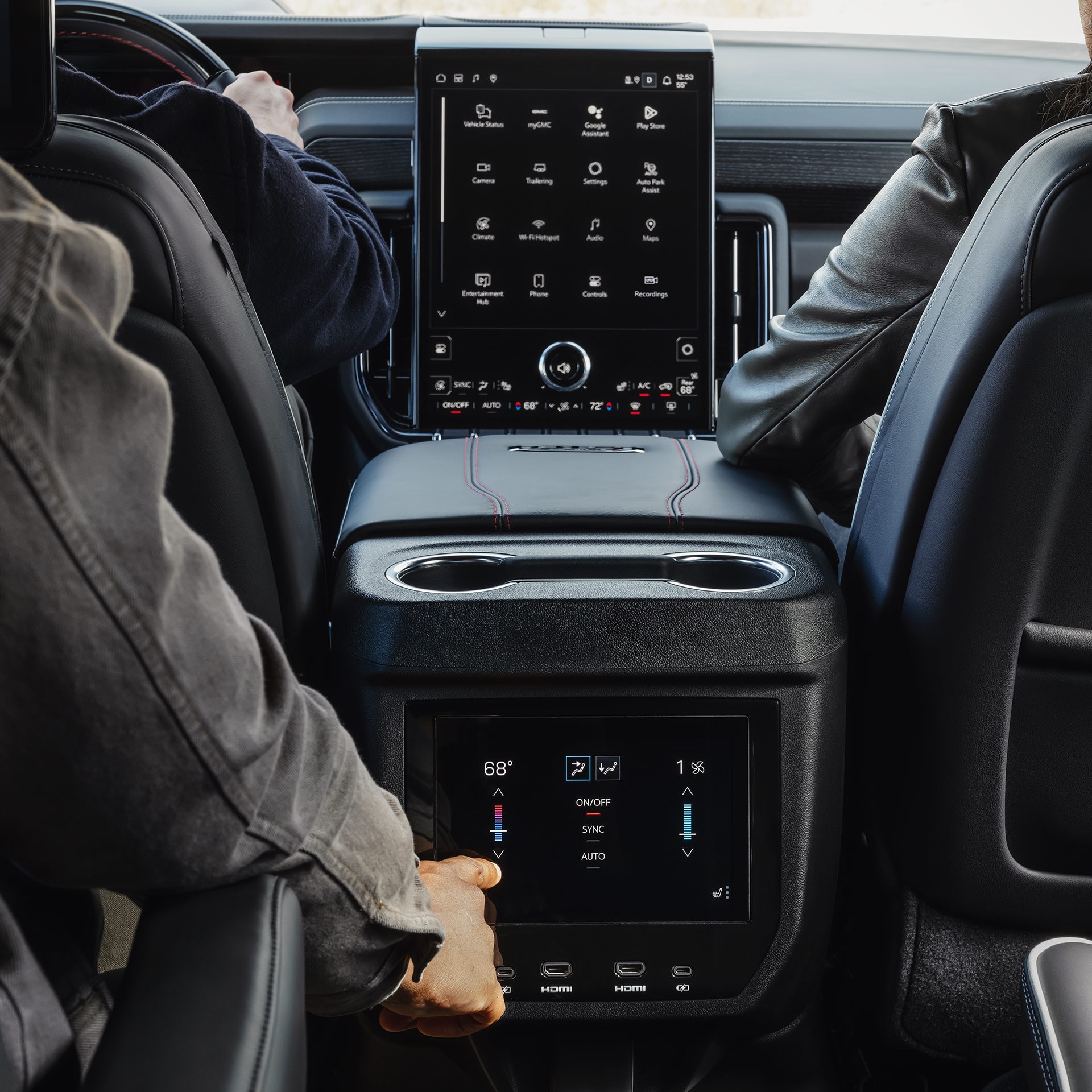 Rear-Seat Passengers Adjusting Climate Controls on the Center Console of a 2027 GMC Yukon