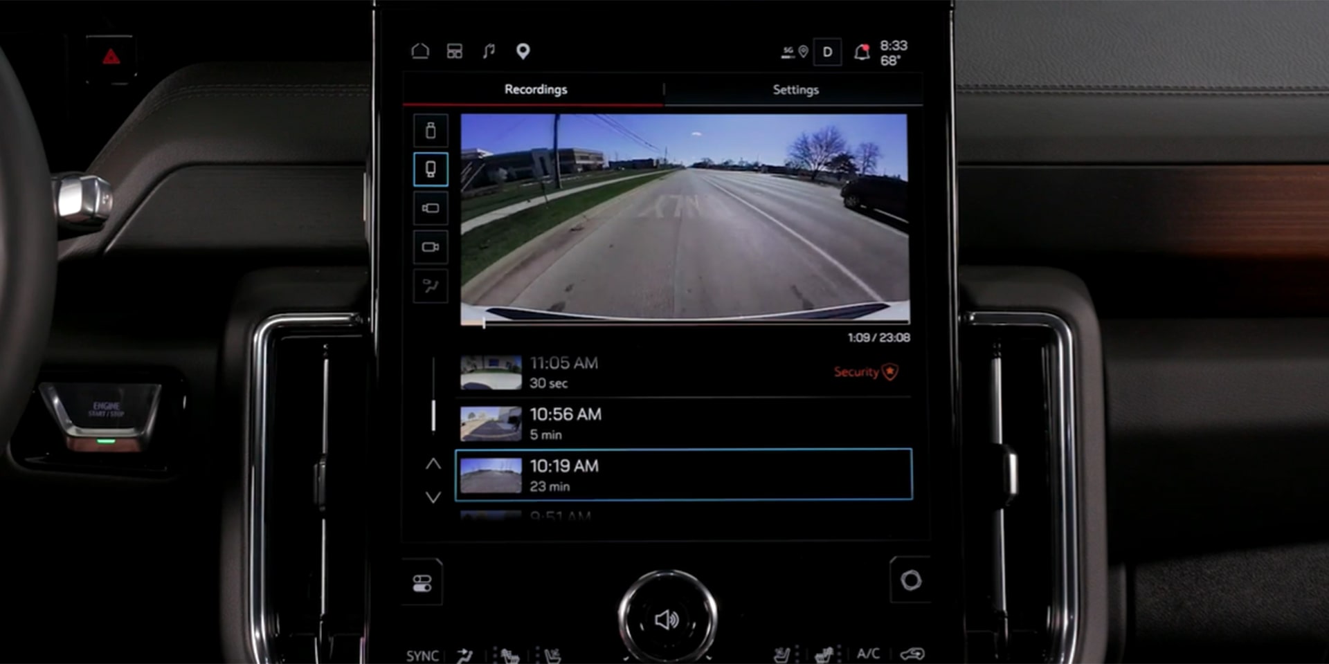 Central Infotainment Screen of a GMC Yukon XL Displaying Security Camera Recordings of a Parking Lot