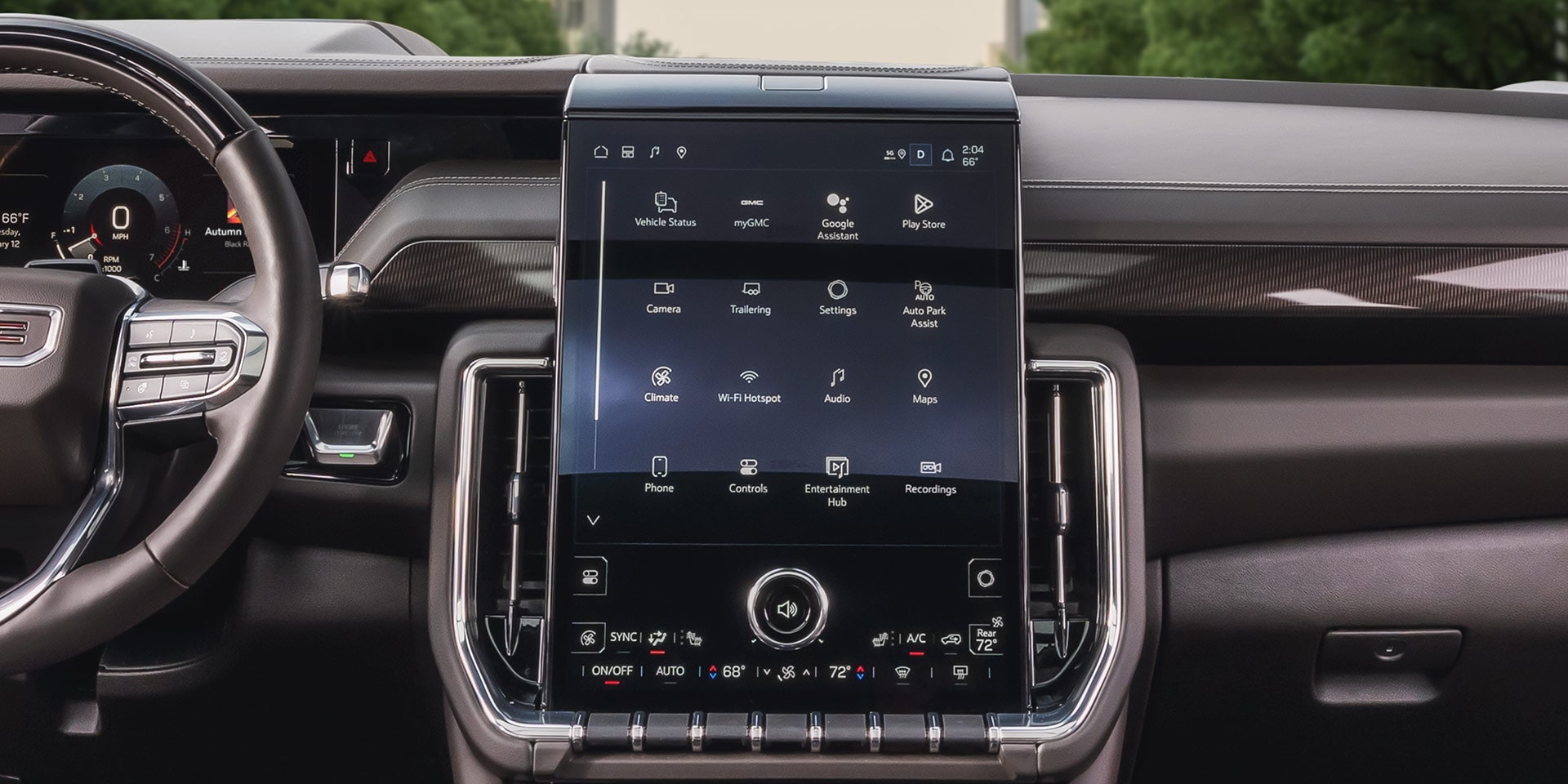 Dashboard of a GMC Yukon XL with a Large Infotainment Touchscreen Displaying App Icons