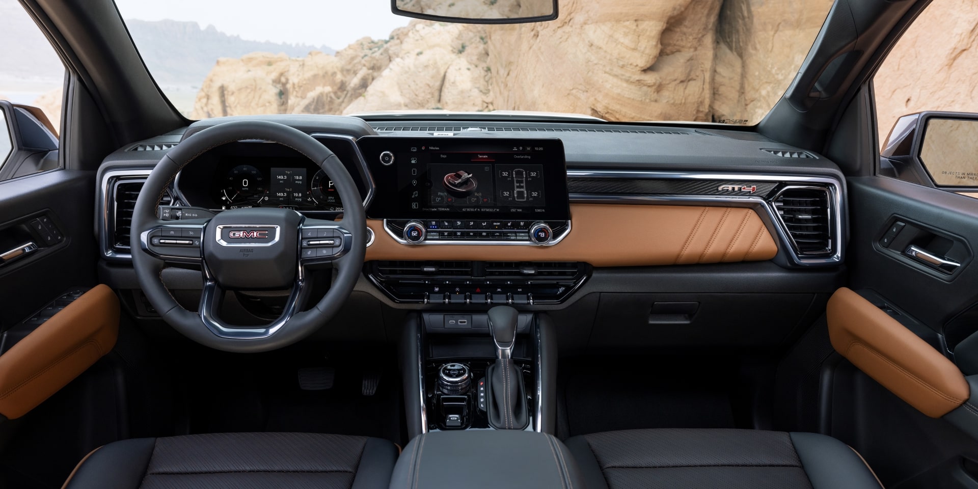 The Full Interior View of the 2027 GMC Canyon with a Steering Wheel Dashboard and Front Seats