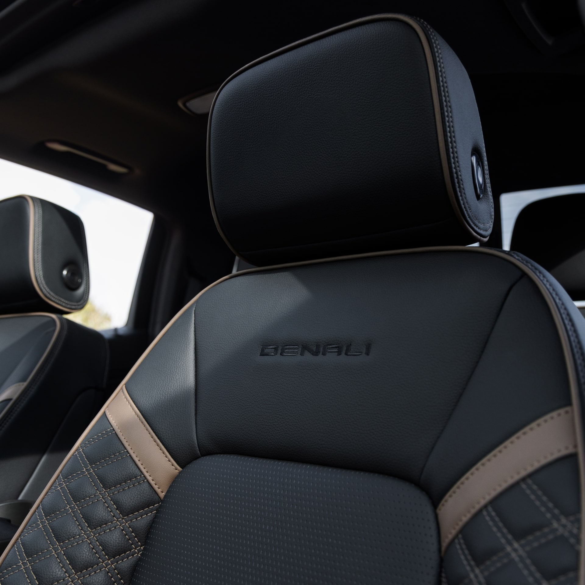 A Close-Up of a Black Leather Seat with the Denali Embroidery in a 2027 GMC Canyon