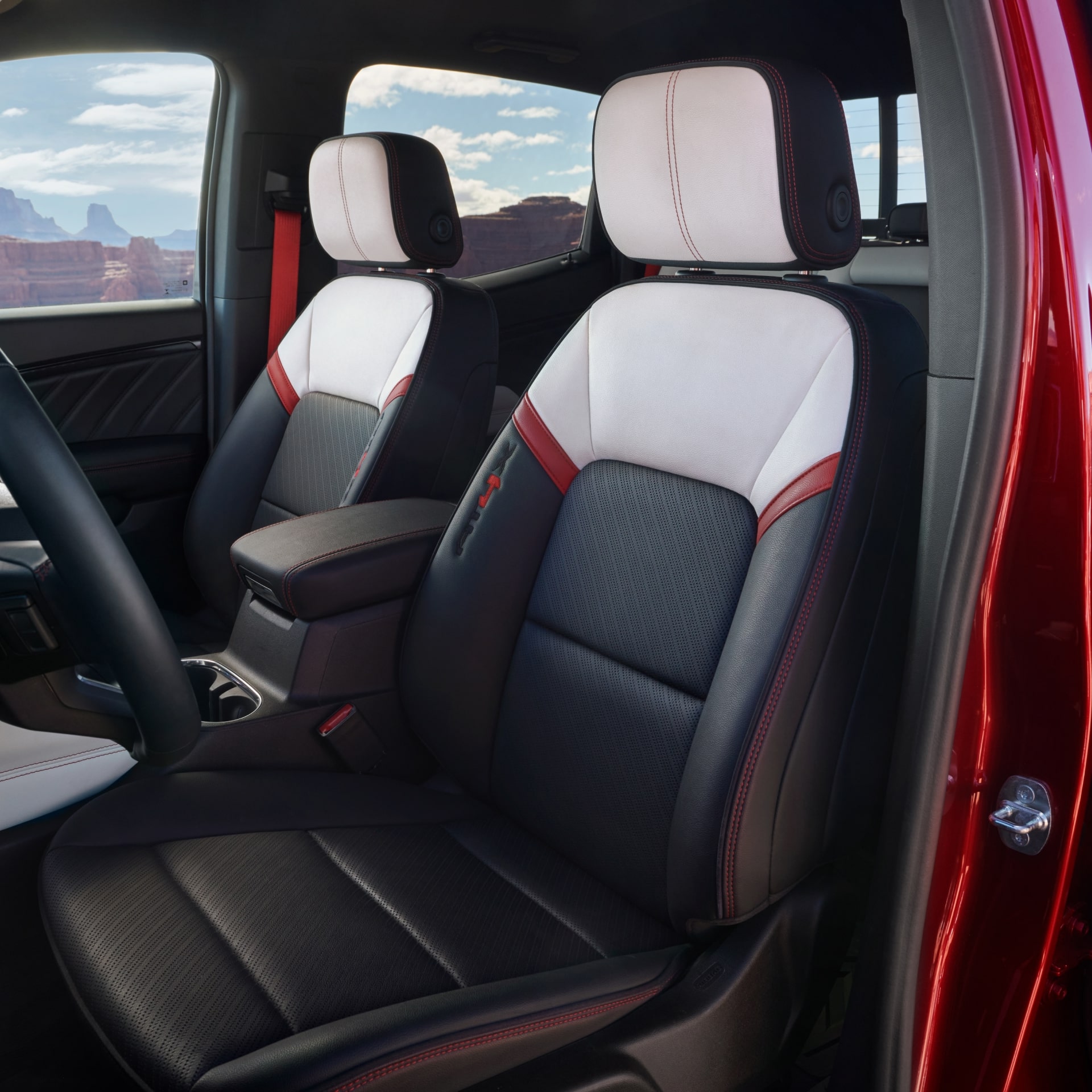 The Red and White Two-Tone Interior Seats of a 2027 GMC Canyon AT4X