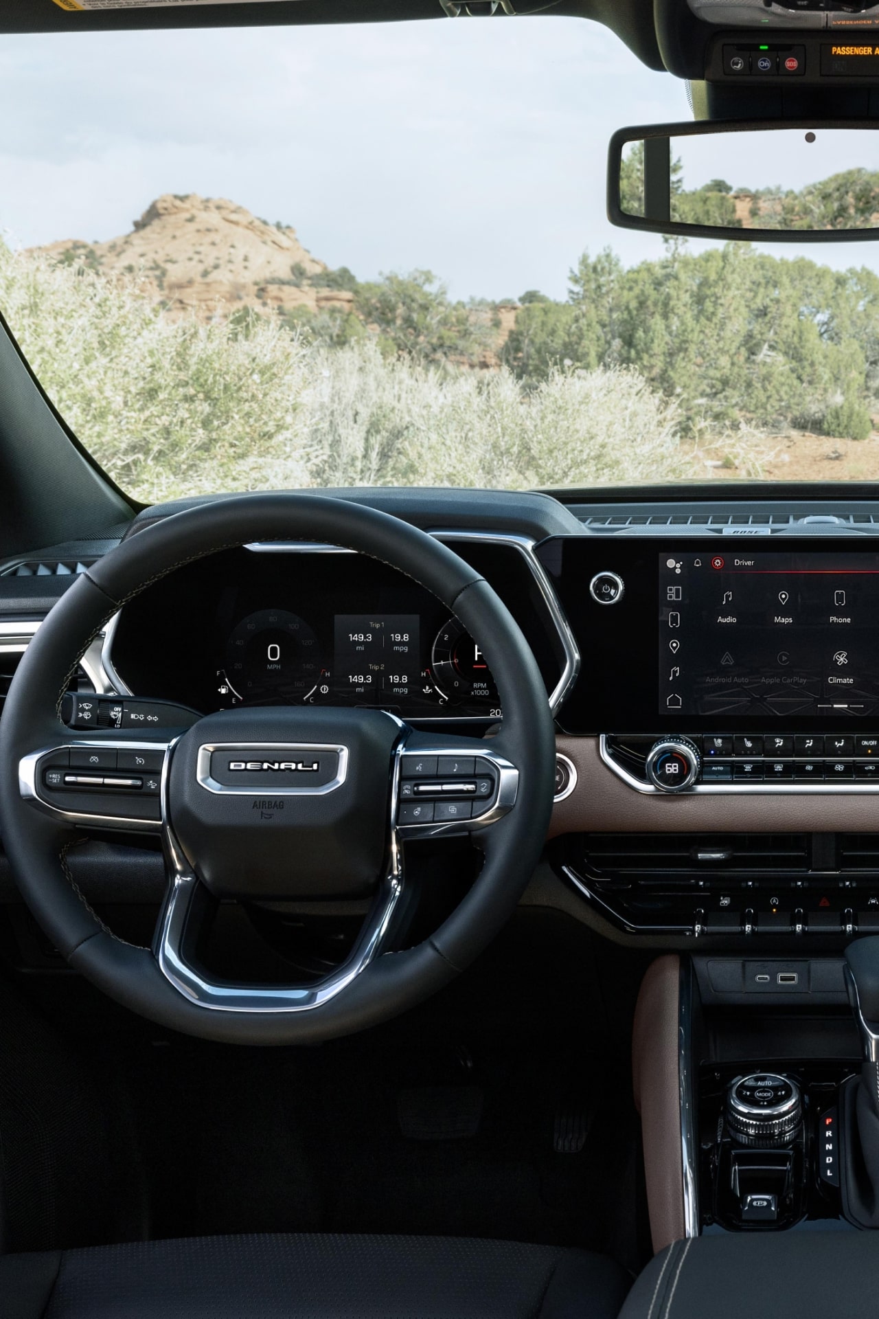 Interior of the 2027 GMC Canyon Dashboard with a Large Infotainment Screen and Brown and Black Trim