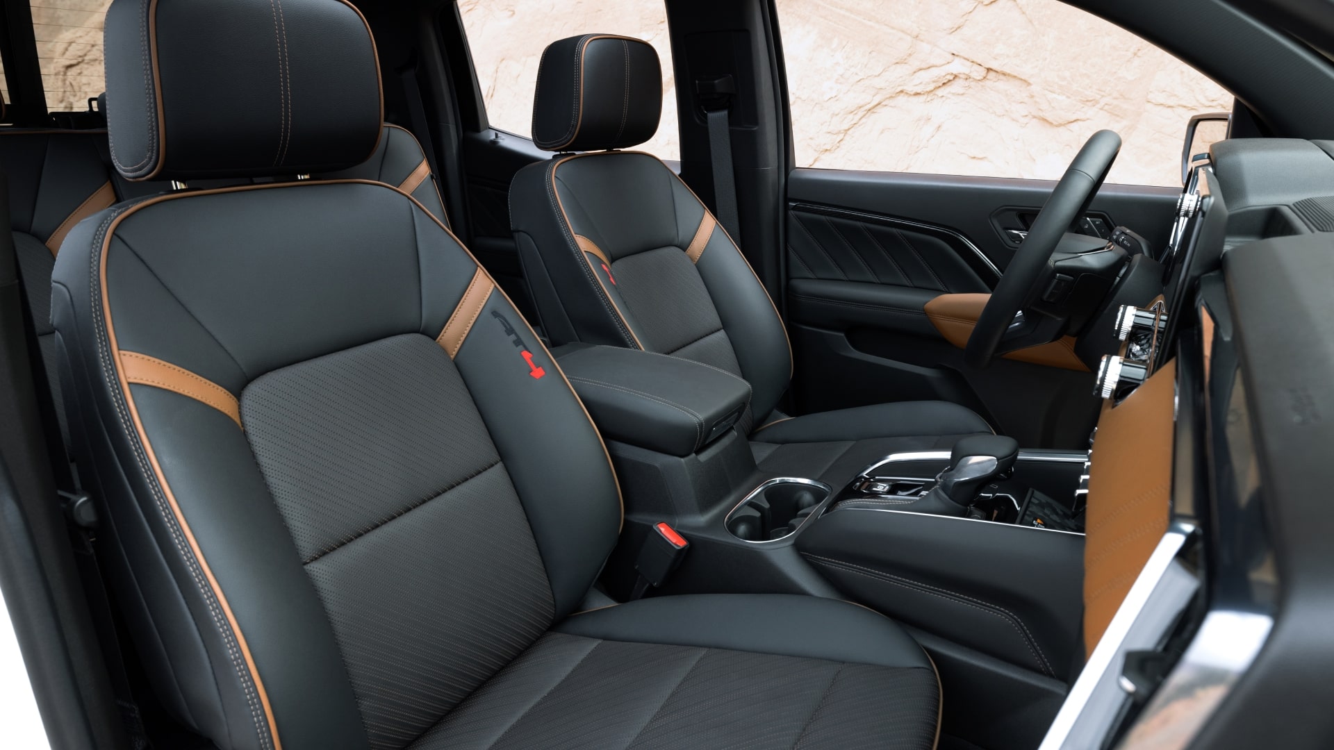 The Black and Tan Two-Tone Interior Seats of a 2027 GMC Canyon AT4