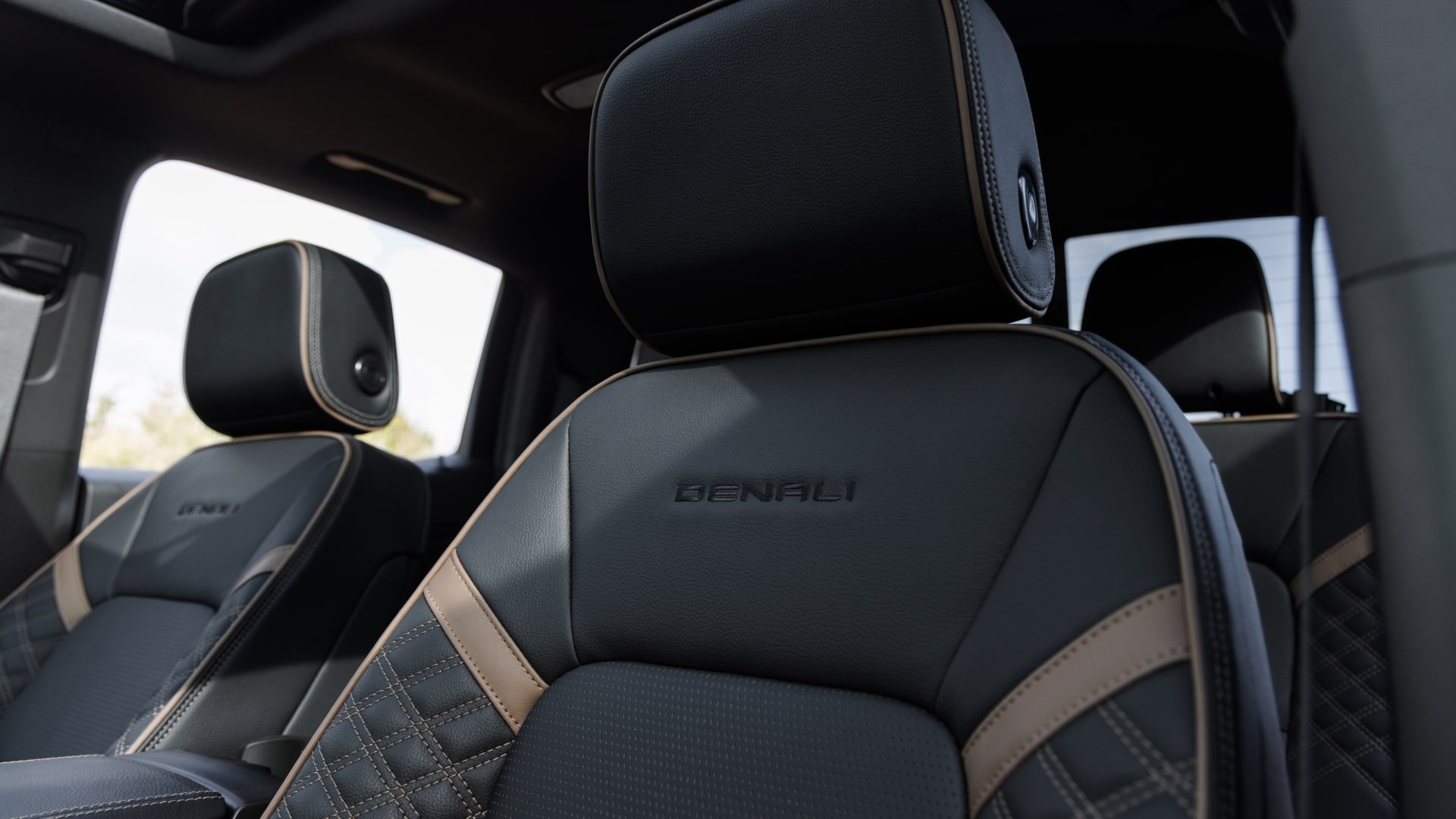 A Close-Up of a Black Leather Seat with the Denali Embroidery in a 2027 GMC Canyon