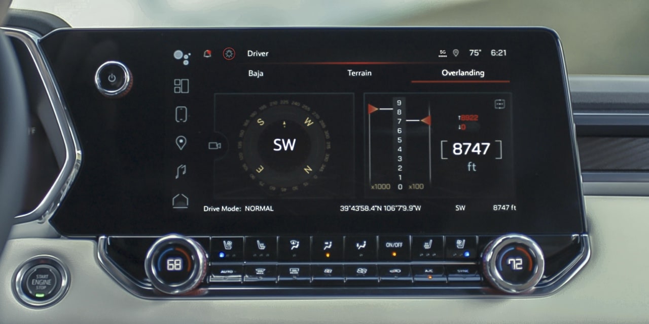 The Large Infotainment Screen Of the 2027 GMC Canyon Displaying a Compass and Audio Controls