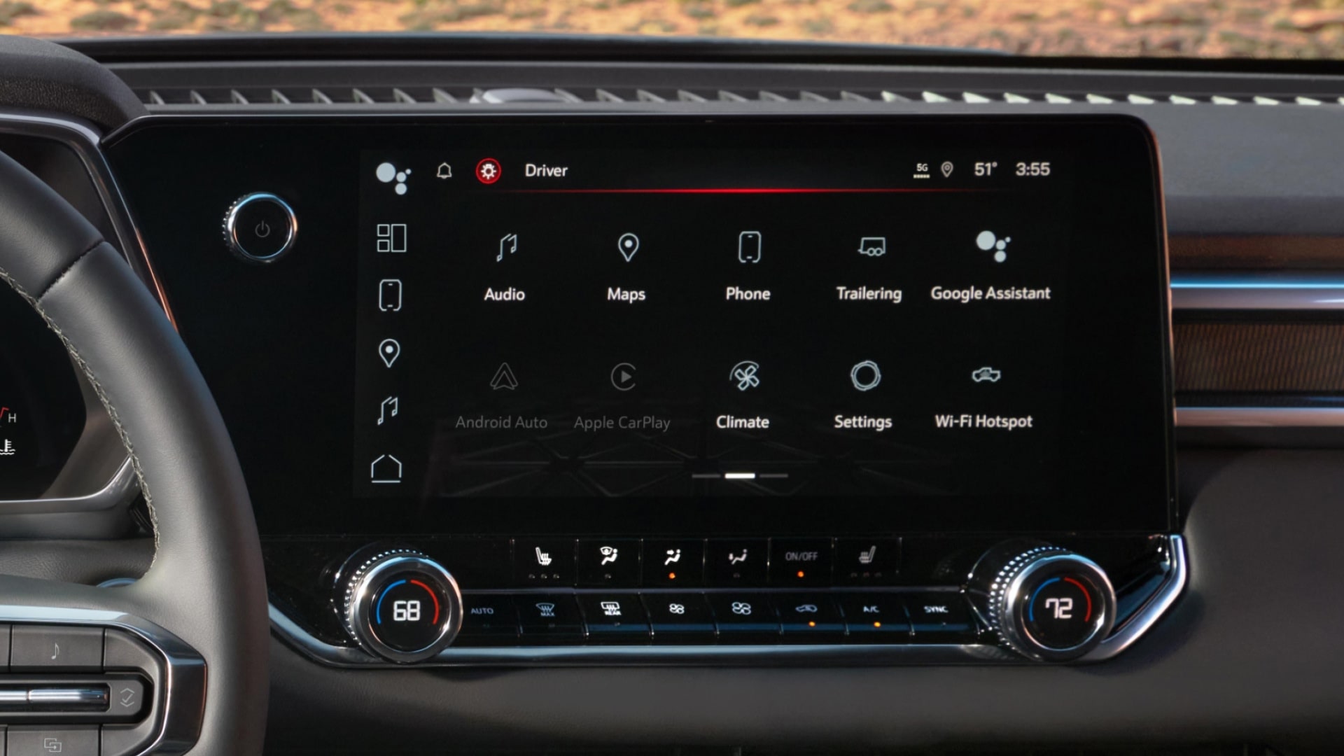 The Interior Dashboard of a 2027 GMC Canyon with an Infotainment Screen Showing Navigation and Climate Control Apps
